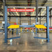 Katool KT-4H850 4 Post 8,500lb Heavy Duty Car Lift shown centered in a mechanic shop