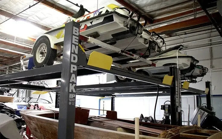 BendPak HD-7500BLX 7,500 lb. 4 Post Vehicle And Boat Storage Lift with two wave runners lifted to max height - Mechanic Super Store