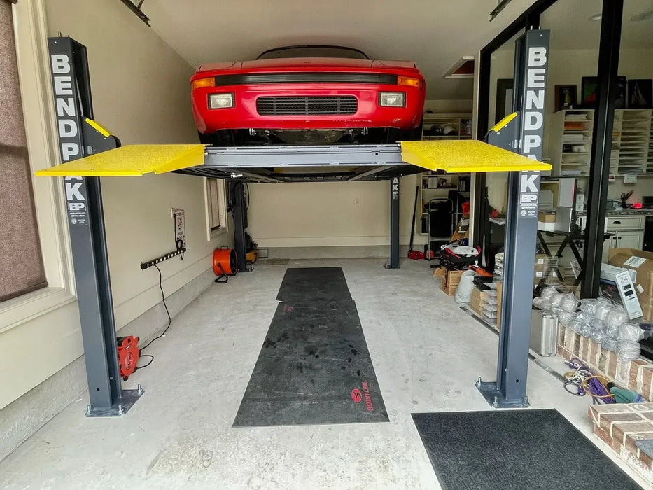 BendPak HD-9 9,000 lb. Super Wide Runway 4 Post Storage Lift in a residential garage- Mechanic Super Store