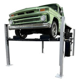 Triumph USA8000XLT 8,000 lb Service & Storage 4 Post Car Lift with a green truck lifted to maximum height - Mechanic Super Store car lift