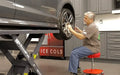 BendPak MDS-6LPF 6,000 lb. Capacity Mid-Rise Scissor Lift showing a mechanic polishing a wheel with a vehicle raised up on the bendpak scissor lift.