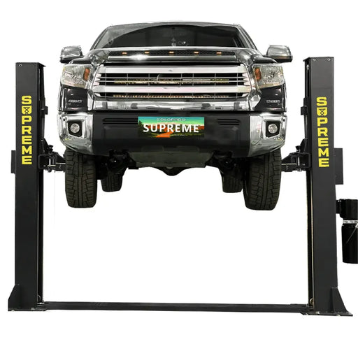 Supreme SP-10FP 10,000 lb Floor Plate 2 Post Car Lift shown from the front view with a truck lifted to he maximum height - Mechanic Super Store