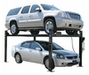 Two cars on an atlas 4 post car lift with a white background