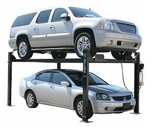 Two cars on an atlas 4 post car lift with a white background